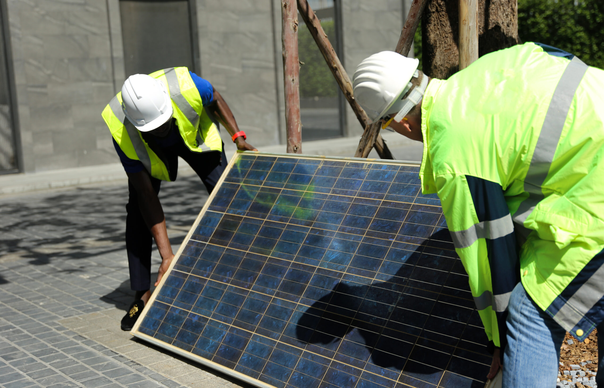 maintenance engineer, Solar energy systems engineer perform analysis solar panels, Portrait of engineer man or worker, people, with solar panels or solar cells on the roof in farm. Power plant with green field, renewable energy source in American. Eco technology for electric power.